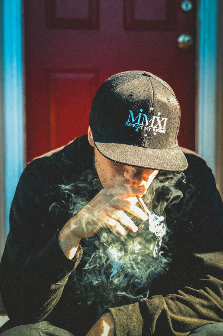 Man in cup smoking weed